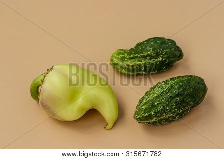 Trendy Ugly Organic Cucumders And Bell Pepper On Light Background, Horizontal Orientation