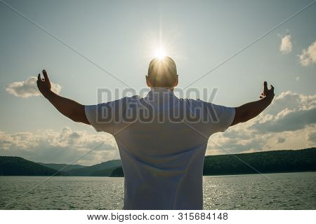 Winner Concept Champion Silhouette On Water And Sun Background