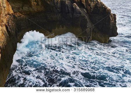 Huge Waves Crash On Cloudy Day. Kemmuna Island