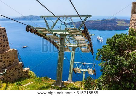 Fira, Santorini Island, Greece Panoramic View, With Cable Car Cabins From Old Port, High Volcanic Ro