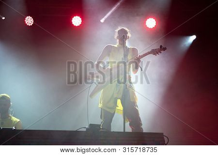 Woman Performer Singing On Stage