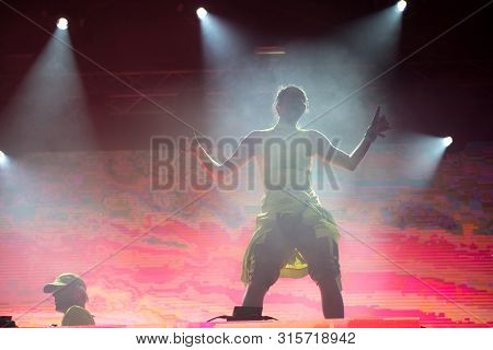 Woman Performer Singing On Stage