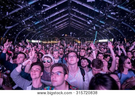 Cheerful Partying Crowd Of People At Music Festival