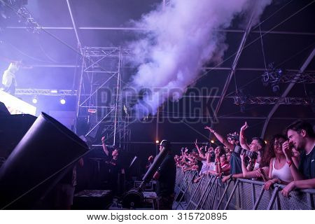 Cheerful Partying Crowd Of People At Music Festival