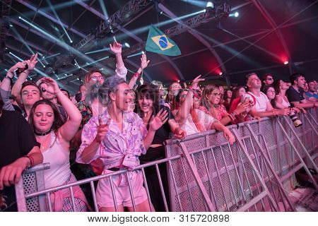 Cheerful Partying Crowd Of People At Music Festival