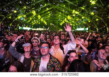 Cheerful Partying Crowd Of People At Music Festival