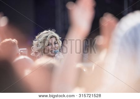 Woman Vocalist Singing Live