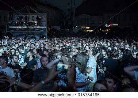 Sibiu, Romania - July 26, 2019: Crowd Of People Headbanging And Partying During An Architects Rock C