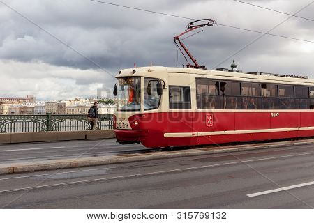 St. Petersburg, Russia - August 03, 2019: Tram On Troitsky Bridge On A Summer Day After Rain. Public