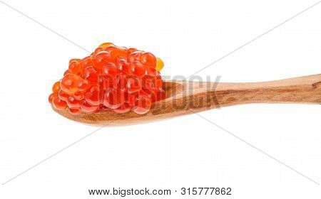 Side View Of Little Wooden Spoon With Salted Russian Red Caviar Of Sockeye Salmon Fish Isolated On W