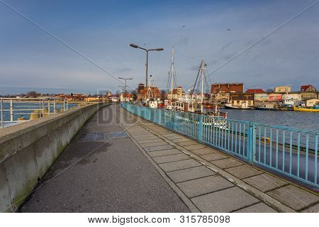 Hel, Poland- 31 January 2015: View Of The Breakwater And Seaport In The City Of Hel. Town And Baltic