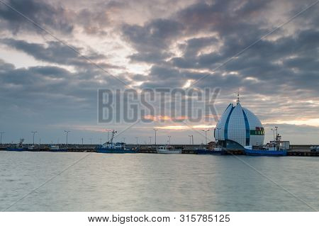 Hel, Poland- 31 January 2015: View Of The Seaport And Breakwater. Boats And Cutters Moored In The Po