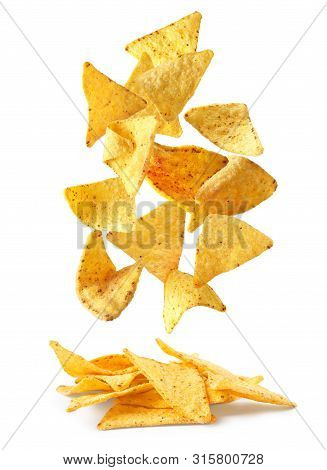 Delicious Mexican Nachos Chips Falling Into Pile On White Background