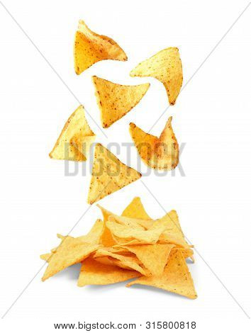 Delicious Mexican Nachos Chips Falling Into Pile On White Background