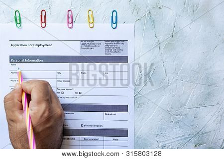 Hand Filling Standard Application For Employment. Hr, Hiring, Applicant Filling Job Application. Hr,