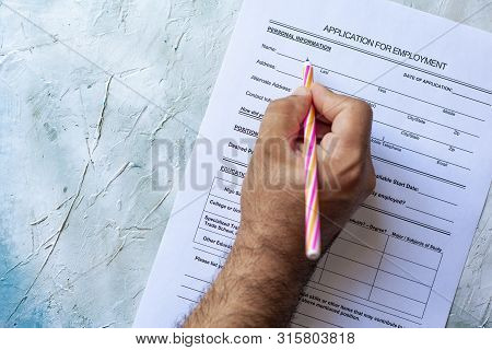 Hand Filling Standard Application For Employment. Hr, Hiring, Applicant Filling Job Application. Hr,
