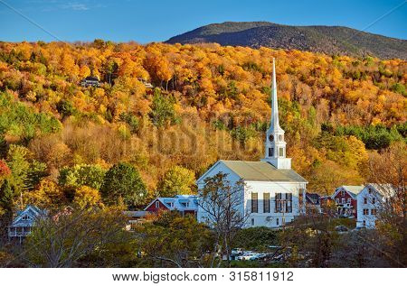 Iconic New England church in Stowe town at autumn in Vermont, USA 