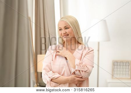 Portrait Of Happy Mature Woman At Home