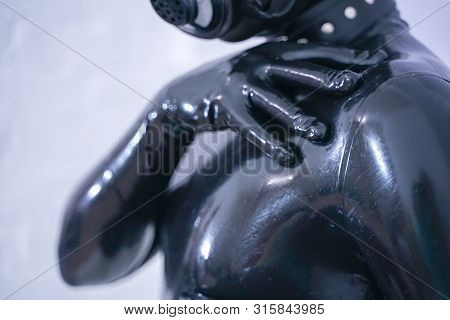 Man In The Latex Rubber Black Catsuit With Gasmask