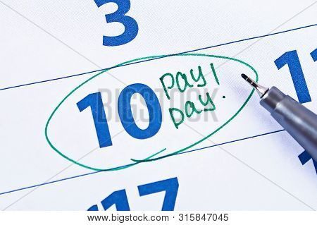 Payday Concept. Business, Finance, Savings Money, Wages, Payroll Or Accounting Concept. Calendar Wit