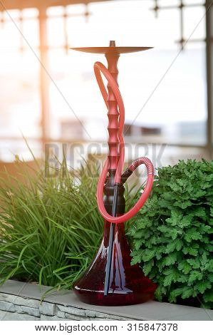 Red Turkish Hookah (shisha) On Green Background