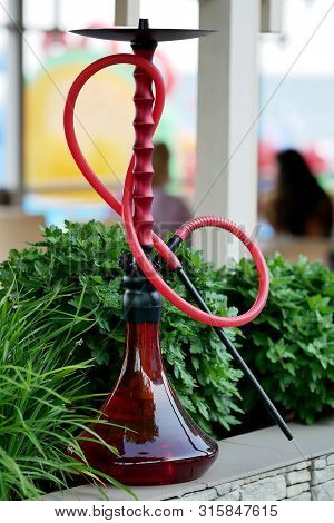 Red Turkish Hookah (shisha) On Green Background