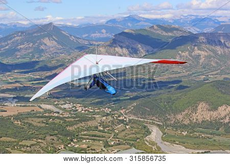 Hang Glider Flying On The Chabre Mountain, France