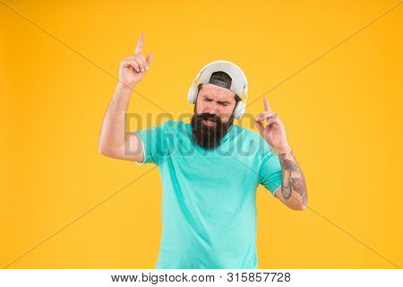 New Disco Party Hit. Dj Man On Yellow Background. Unshaven Guy Enjoying Tune Playing At Dj Party. Be