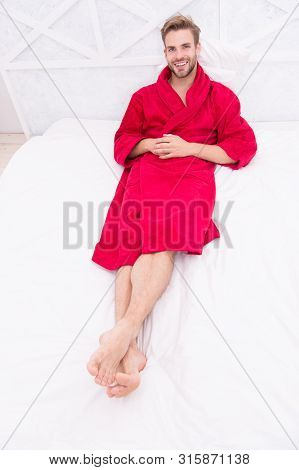 Guy In Bathrobe Relaxing. Maintaining Consistent Circadian Rhythm Essential For General Health. Man 