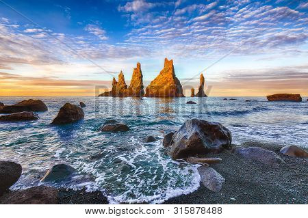 Incredible View Of  Rock Formations Troll Toes On Black Beach Reynisfjara Near The Village Of Vik.
L