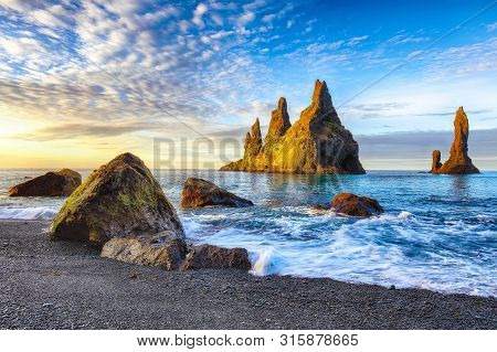 Incredible View Of  Rock Formations Troll Toes On Black Beach Reynisfjara Near The Village Of Vik.
L