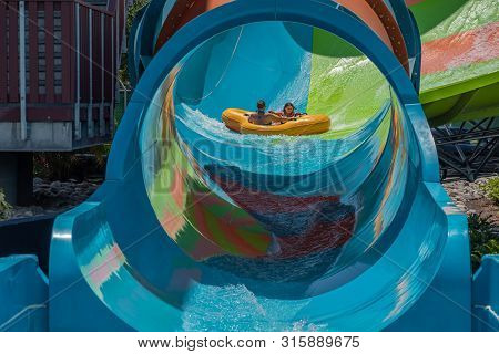 Orlando, Florida. July 29, 2019. People Enjoying Kare Kare Curl Water Attraction At Aquatica