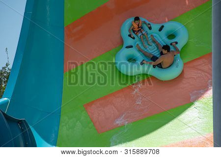 Orlando, Florida. July 29, 2019. People Enjoying Kare Kare Curl Water Attraction At Aquatica 5