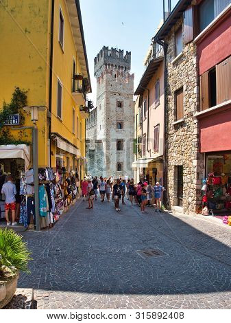 Sirmione, Lombardy / Italy - July 07, 2019 Scaligero Castle And Local Businesses With Visitors Seen 