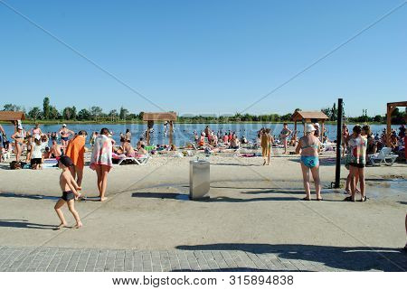 People Bathe In A Salt Lake At A Balneological Resort In Slavyansk Near Donetsk, Ukraine, June 15, 2