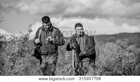 Army Forces. Camouflage. Military Uniform. Man Hunters With Rifle Gun. Boot Camp. Hunting Skills And