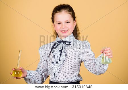 Science Research In Lab. Small School Girl. Small Smart Girl With Testing Flask. Education And Knowl