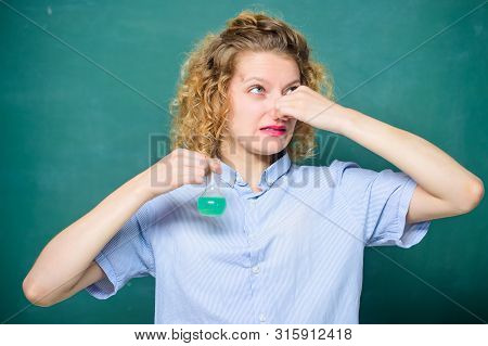 College Student Performing Chemical Reaction. Chemical Liquid Smelling Really Bad. Disgusting Experi