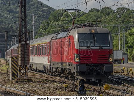 Red Slovakia Train In Kysak Station In East Slovakia In Summer Morning