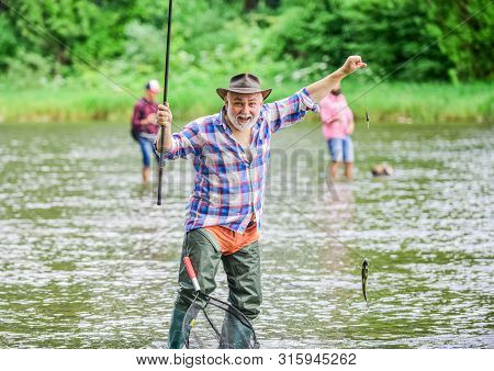 Best Moment. Mature Man Fishing. Summer Weekend. Fisherman With Fishing Rod. Pothunter. Man Catching