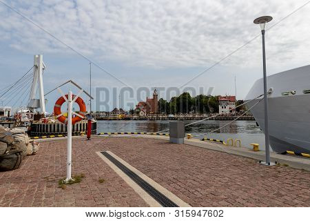 Ustka, Pomeranian / Poland - August 7, 2019: View Of The Fishing Port On The Baltic Sea. Harbor Buil