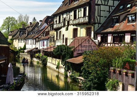 Colmar, France - April 18, 2019. Romantic Boat Trip Along The Canal In The Little Venice Of Colmar. 