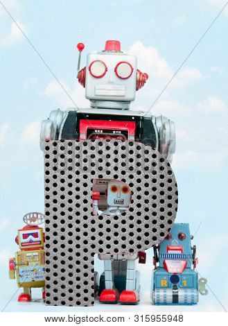 retro robots holding a big  metal letter P with blue sky and clouds