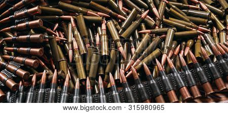 Different Ammo On Wooden Background, Weapon Concept.