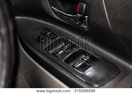 Novosibirsk, Russia - July 17, 2019:  Toyota Opa , Close-up Of The Side Door Buttons: Window Adjustm
