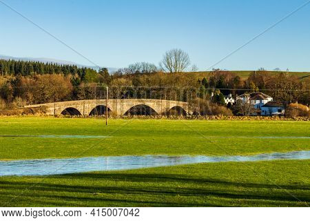 A Flooded Green Field And The Ken Bridge At New Galloway, Dumfries And Galloway, Scotland