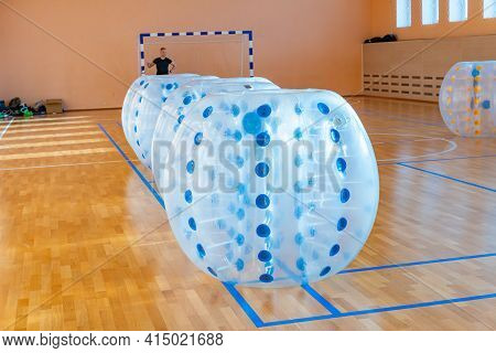 Colorful Bumper Ball Bubble Balloons In The Sports Hall. Equipment For Team Building Sport Game Name
