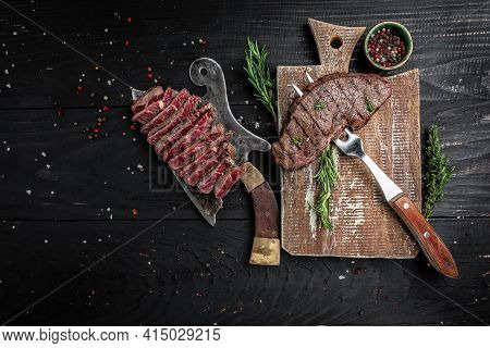 Traditional American Barbecue Dry Aged Rump Steak From Sliced On A Board Butcher And Fork. Banner, M