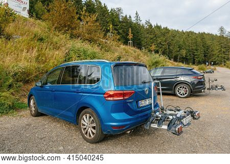 Mummelsee, Germany - Sep 22, 2018: Rear View At The Lava Blue Colored Volkswagen Touran Van With Bik