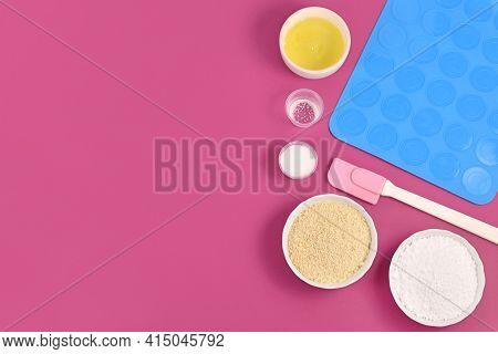 Ingredients For Making Homemade French Macaron Sweets Including Powdered Sugar, Ground Almonds, Egg 